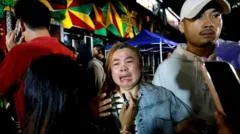 Witness says he crawled for exit as flames swept through Bangkok bar