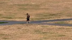 Heatwave to intensify in second week as wildfires burn across UK